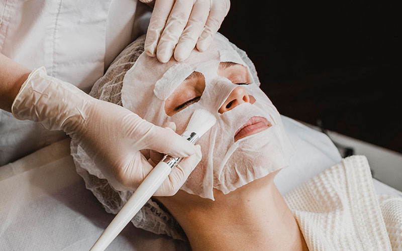 Material being applied to skin in a cosmetic context